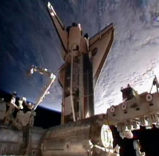 In this frame grab from video taken from NASA television, space shuttle Discovery is seen moments after docking at the International Space Station, its final visit before being parked at a museum, Saturday, Feb. 26, 2011.